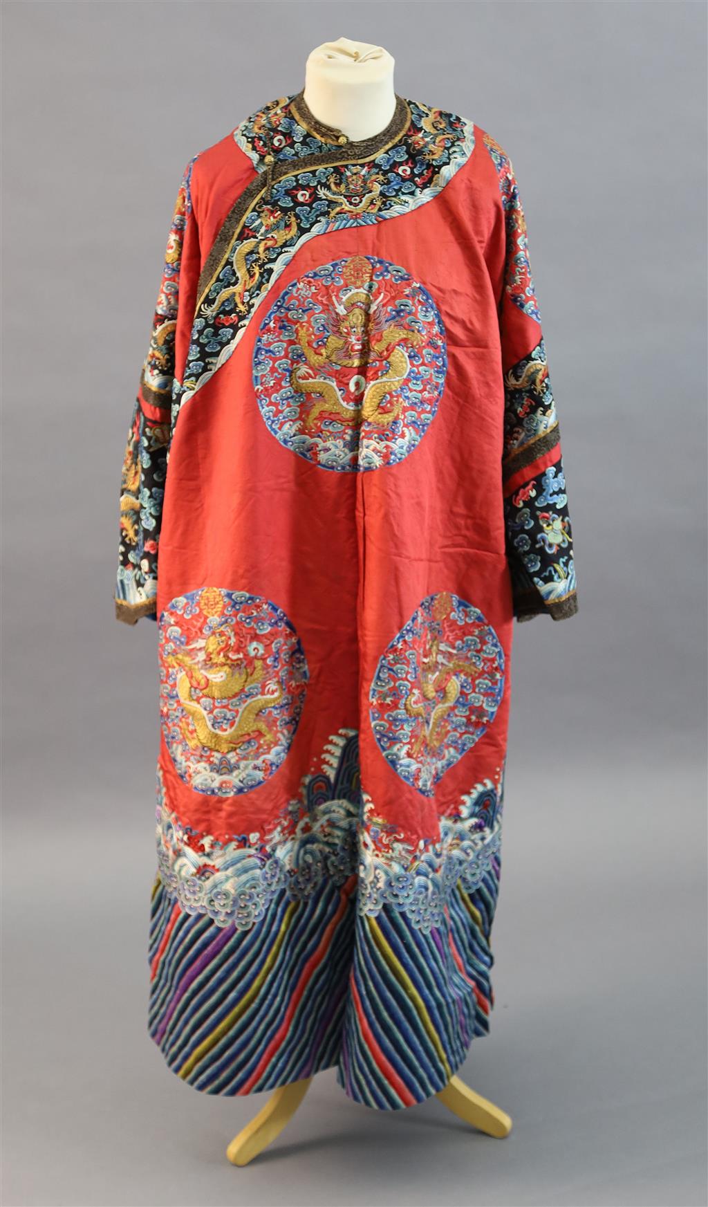 A Chinese red satin dragon winter robe, late Qing dynasty, length 129cm